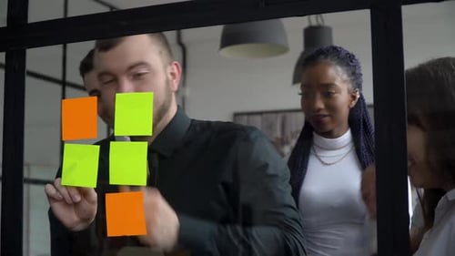 Business Team Brainstorms Together in an Urban Office