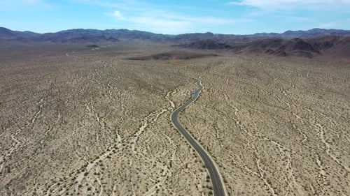 Scenery Of Desert Road Along Joshua Tree National Park In California, USA. Aerial Wide Shot