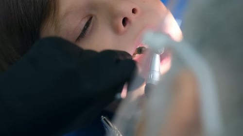 Child Receives Dental Treatment Close Up