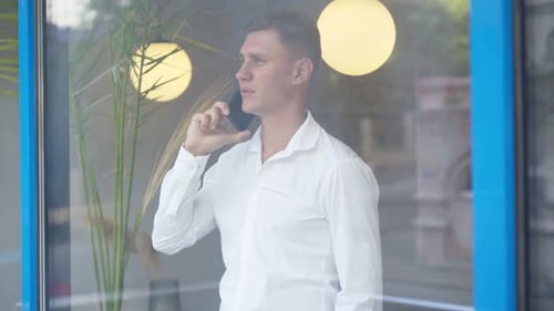 Young Adult Talking on the Phone in the City