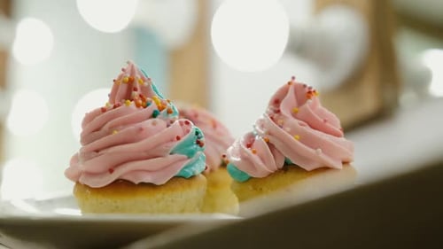 Delicious Cupcakes with Pink Frosting and Sprinkles