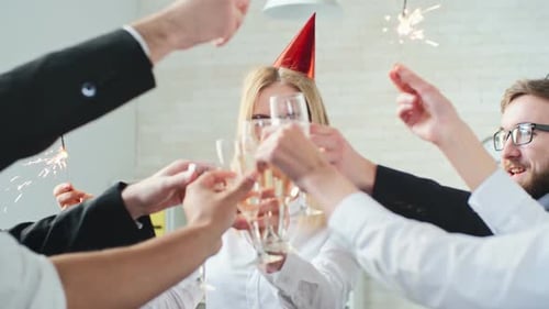 Festive Office Party with Champagne Toast and Sparklers