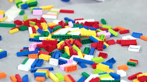 Colorful Building Blocks Scattered on Gray Surface