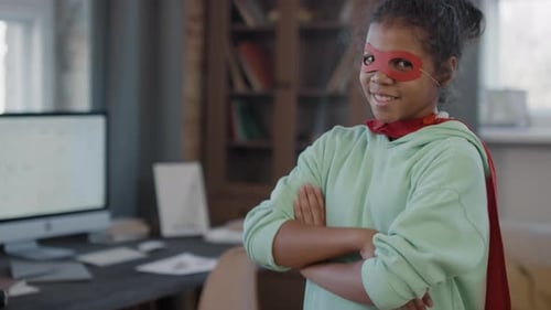 Smiling Girl in Homemade Superhero Costume Stands Proudly