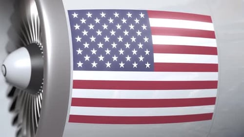 US Flag on Aircraft Jet Engine with Rotating Turbine Blades