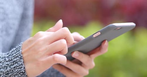 Woman hold with cellphone at outdoor