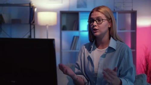 Young Woman Discussing Something in a Video Call