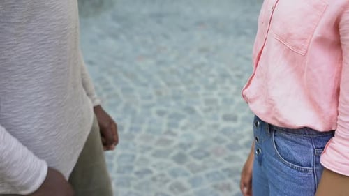 People Joining Hands in City