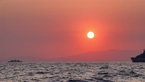 Silhouette Of Warship In The Sunset