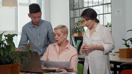 Diverse Team Working Together in Office