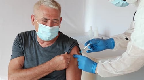 Senior Man Receives Vaccine at Clinic