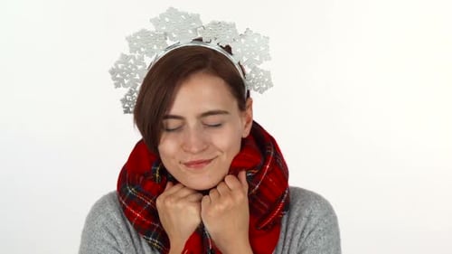 Woman Wearing Snowflake Headband and Plaid Scarf