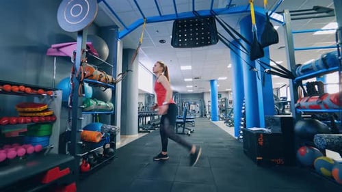 Beautiful woman working out in gym. Healthy young athletes woman doing exercises at gym