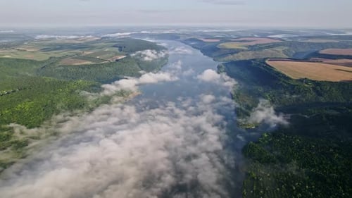 Aerial Drone View of Beautiful River Between Mountains Fields During Misty Morning