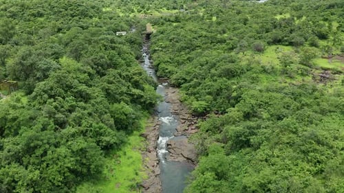 Drone approaching to a small bridge on a Jungle stream in the Western Ghats forest