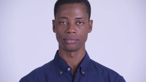 Young Man Looking at Camera with Neutral Expression