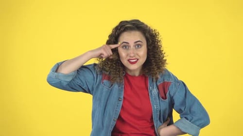 Indignant Woman Throwing Up Hands Expressing She Is Innocent, Twists His Finger at His Temple, Slow