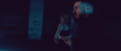 Couple Dancing Intimately in Dark Urban Setting