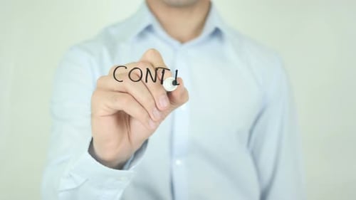 Man Writing Continuous Improvement on Clear Surface
