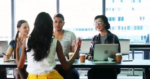 Team of Young Adults Working at Urban Office