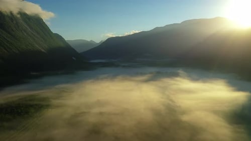 Morning Mist Over the Valley Among the Mountains in the Sunlight