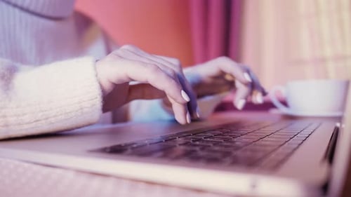 Woman's Hands Typing on Laptop Keyboard Close Up