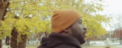 Black Man Jogging in Park