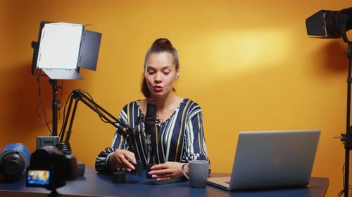Young Woman Vlogging About Technology Equipment