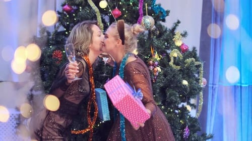 Women Exchanging Christmas Gifts and Celebrating Holiday