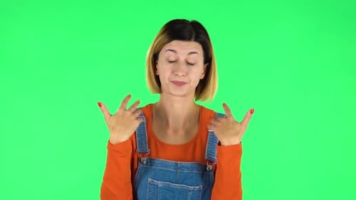 Young Tired Woman Cooling Herself By Her Hand, Suffering From High Temperature Weather. Green Screen