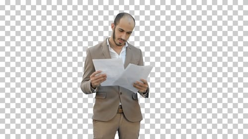 Serious young businessman standing and, Alpha Channel