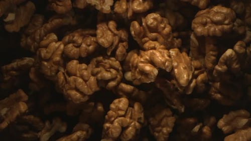 Walnut Nuts Thrown In The Air In High Speed Flying On Black Background 4k
