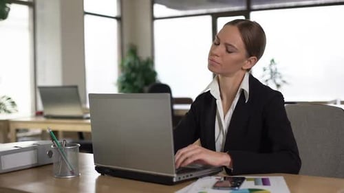 Employee Suffering Neck Pain While Working on Laptop, Stressful Day in Office