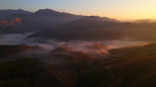 Flying over the clouds during morning sunrise. wonderful morning sunrise natural Landscape.