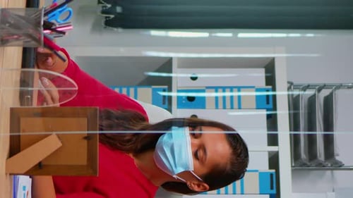 Vertical Video: People Wearing Face Masks Back at Work in Office