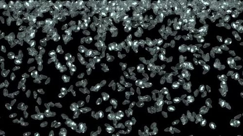 Diamonds falling on black background