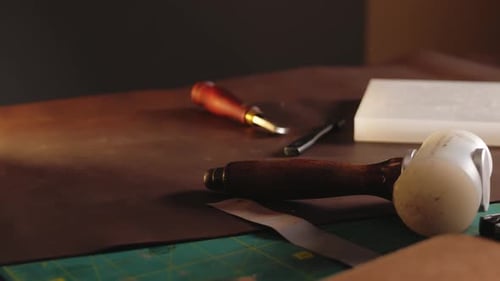 Leather Crafting Tools on a Workbench Close Up
