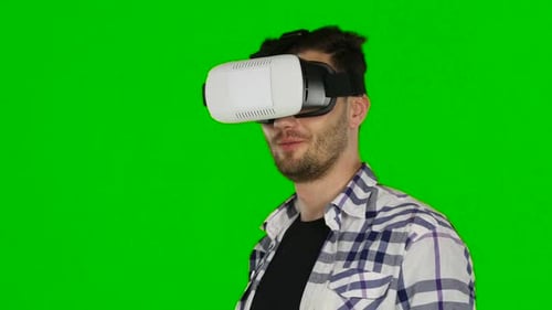Virtual Reality Game. Girl with Pleasure Uses Head-mounted Display. Green Scree. Close Up