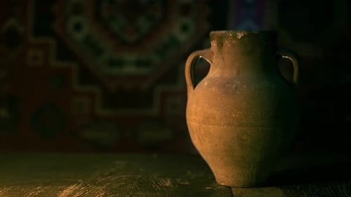 Antique Clay Vase on Rustic Wooden Table