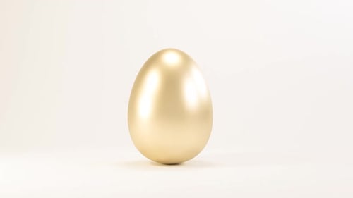 Golden Egg Rotating on White Background