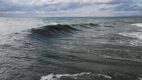 Powerful Ocean Waves Crashing Along Coastline