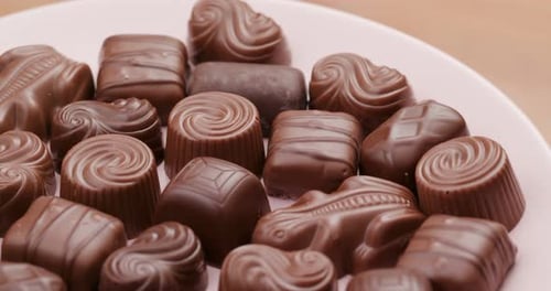 Pile of Assorted Milk Chocolate Candies on Plate