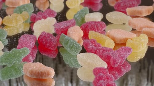Colorful Gummy Candies Reflect on Glass