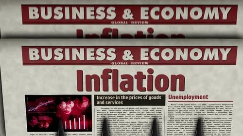 Business and Economy Headlines on Scrolling Newspaper Pages