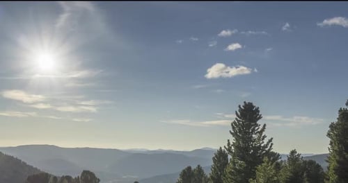 Mountain Meadow Timelapse. Wild Nature and Rural Field. Clouds, Trees, Green Grass and Sun Rays