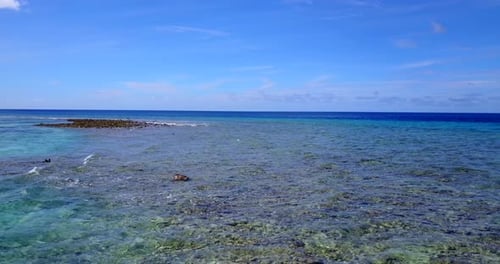Wide birds eye copy space shot of a summer white paradise sand beach and aqua blue water background