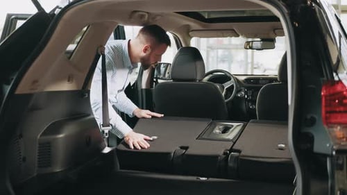 Man Choosing Vehicle in Showroom