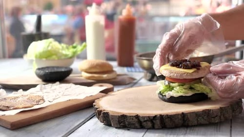 Assembling a Gourmet Burger in an Urban Setting