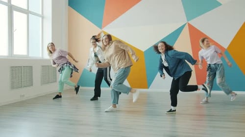 Happy Students Dancing Together in Dance Studio Enjoying Modern Art Learning Movements