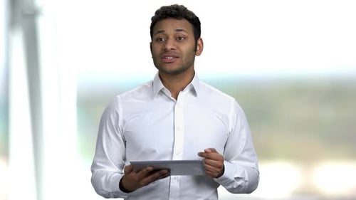 Adult Man Explains While Using Tablet
